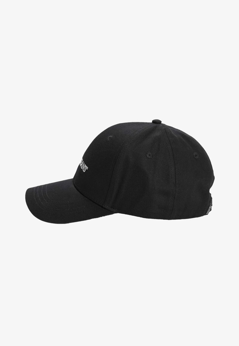 Black baseball cap made of fabric, featuring a rounded crown and a stiff brim. Notable details include embroidered logo and ventilation eyelets.