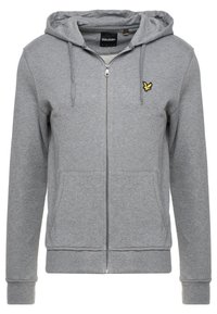 Grijze zip-up hoodie met een kangoeroezak, verstelbare capuchon met trekkoord en een geel geborduurd logo op de linkerborst. Zachte stoffen textuur.