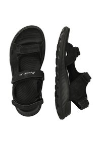 Musta sandaalit, jotka on valmistettu synteettisestä materiaalista, säädettävillä hihnoilla, tekstuurilla varustetulla pohjalla ja kestävällä kumipohjalla, jossa on uritetut kuvioinnit.