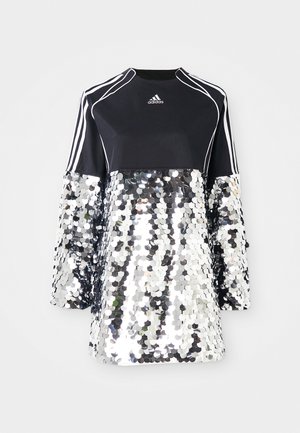 Black Adidas long-sleeve top with white stripes and piping, featuring large shiny silver sequins covering the lower part and sleeves.