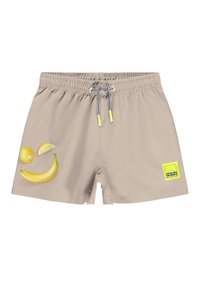 Costumi da bagno beige con elastico in vita, caratterizzati da stampe di banane e limoni gialli sul davanti e una toppa verde con logo sul lato.