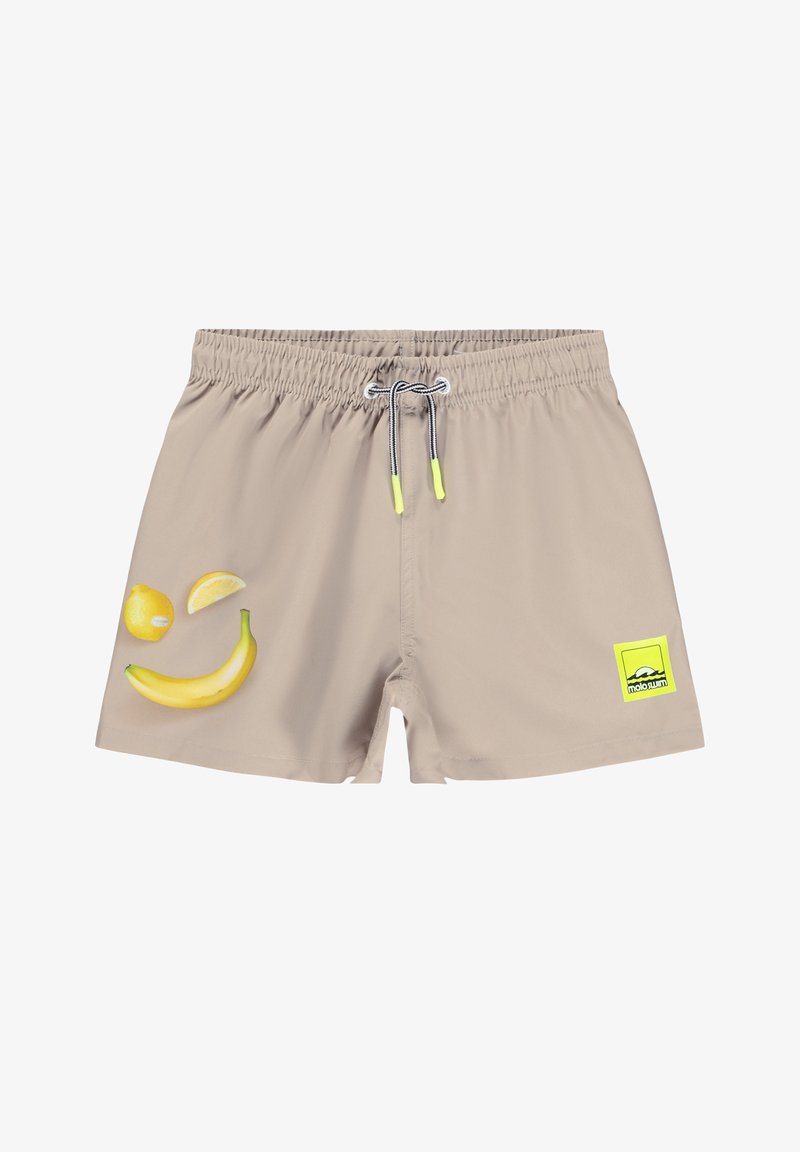 Maillots de bain beiges avec une taille élastique, ornés d'imprimés de bananes jaunes et de citrons sur le devant et d'un patch logo vert sur le côté.