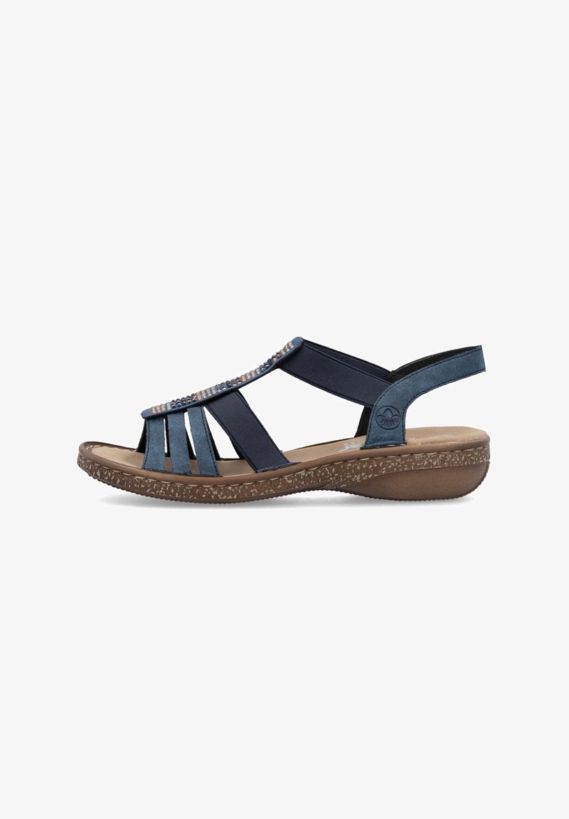 Navy blue sandal with open strap design, beaded accents, soft footbed, and textured brown sole. Features a low wedge heel.