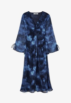 Long flowy dress in dark blue tie-dye print, featuring a deep V-neck, gathered center, and bell sleeves with tie details. Lightweight fabric.