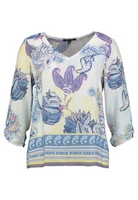 Blouse à motifs floraux avec décolleté en V, manches trois-quarts, et couleurs pastel. Fabriquée en tissu léger avec des accents bleus et violets.