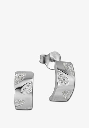 Boucles d'oreilles en argent en forme de créoles avec une surface lisse et des pierres étincelantes intégrées dans des motifs ondulés. Marquées "925" pour l'argent sterling.