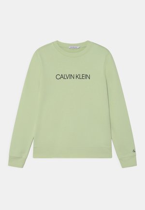 Felpa verde chiaro con maniche lunghe, scollatura rotonda e "CALVIN KLEIN" stampato in nero sul petto. Polsini e orlo a costine.