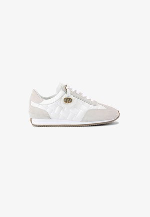 White and light gray sneaker featuring a quilted design, suede and leather materials, round toe, and lace closures with a gold accent.