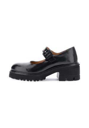 Zapatos Mary Jane de cuero negro con punta redondeada, correa ajustable con hebilla, suela de goma texturizada y tacón ancho.