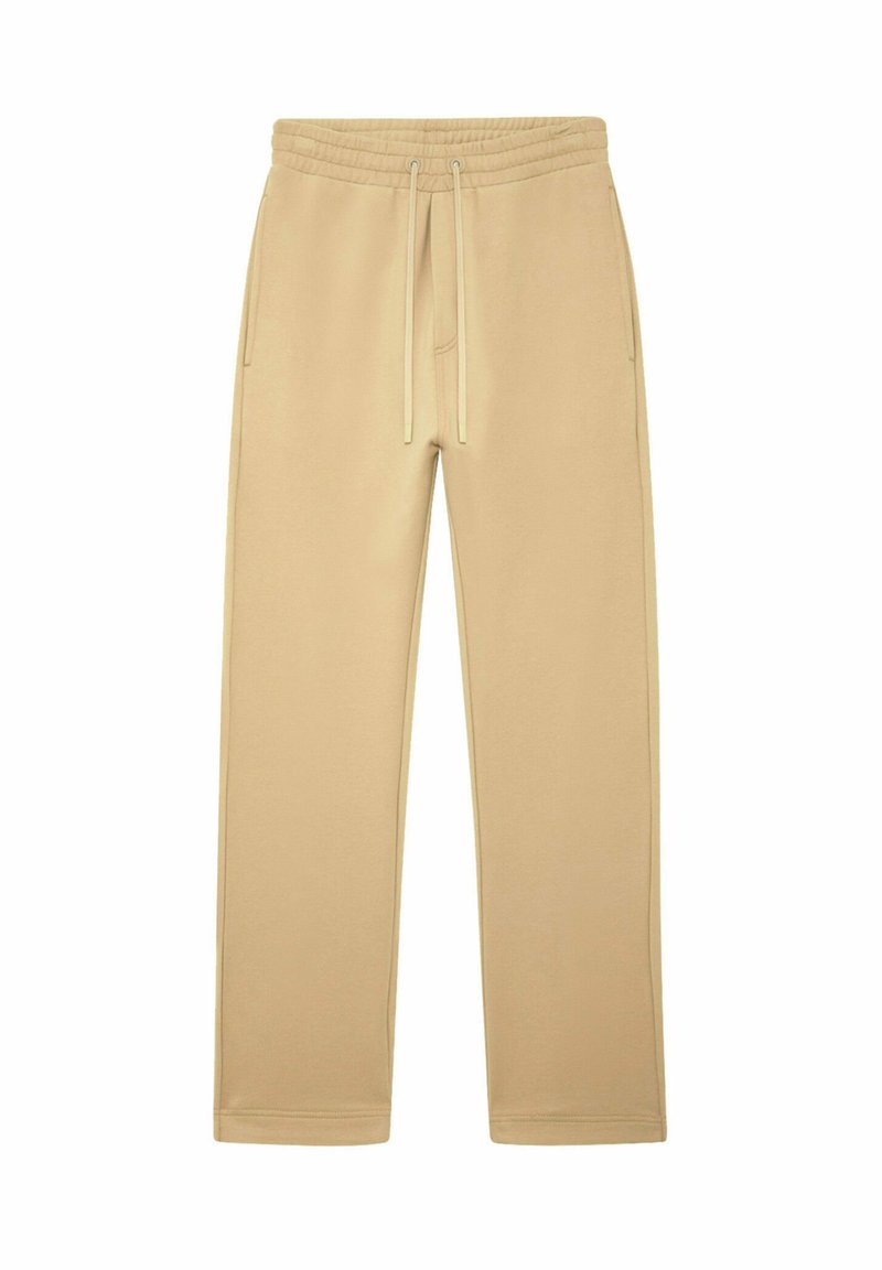 Pantalons de survêtement beige à cordon de serrage avec taille élastique et poches latérales, design à jambes droites, posés à plat sur un fond blanc.