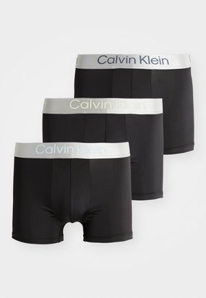 Boxer-briefs noirs au toucher lisse, avec une ceinture grise clair portant le logo "Calvin Klein". Ensemble de trois paires identiques.