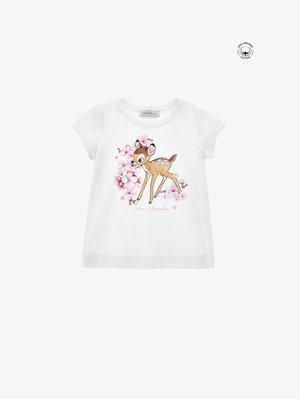 Hvit t-skjorte i organisk bomull med korte ermer, med et grafisk motiv av en brun hjort omgitt av rosa blomster. Myk, glatt tekstur, uformelt design.