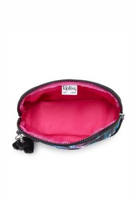 Black and purple floral cosmetic pouch with a bright pink interior, zip closure, and a black pom-pom accent. Label reads "Kipling Live Light."