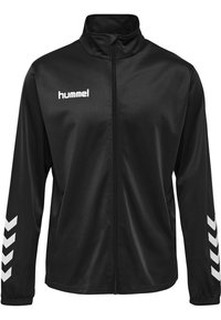 Schwarze Zip-Jacke aus glattem, leichtem Material, mit hohem Kragen, weißem Logo und Zickzackmustern auf den Ärmeln.
