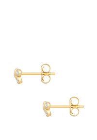 Kuldsed stud-kõrvarõngad, millel on ümmargune kuju ja kaks selget kivi. Sile pind poleeritud viimistlusega ja kindel kinnitusega post.