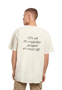 Merchcode HEARTBREAK HEAVY  - T-shirts print - sand