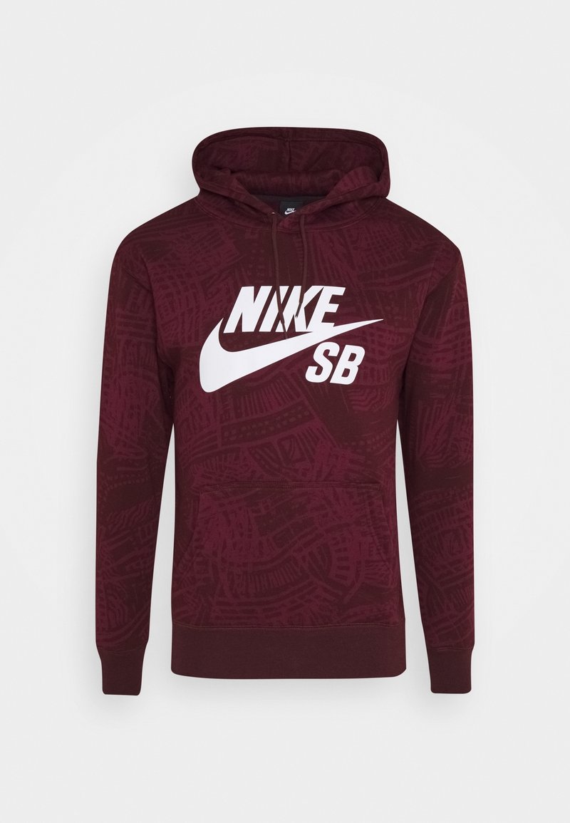 Bordeaux huppari, jossa on teksturoitu kuosi, valkoinen "NIKE SB" -logo rinnassa, nyörillä varustettu huppu ja etupuolella kenguru-tasku.