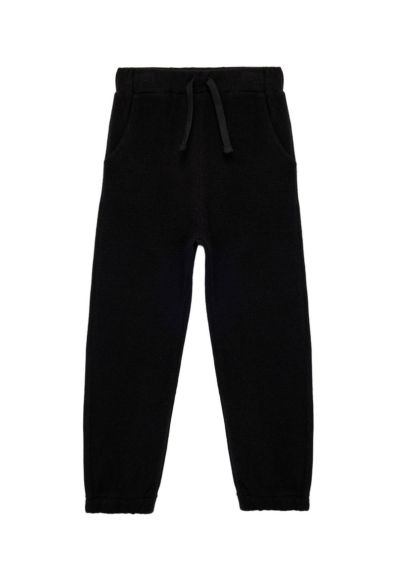 Sorte sweatpants med waffle-tekstur, elastisk talje og snøre. Har to sidelommer og smalle benåbninger.