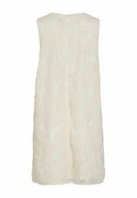 Robe blanche mi-longue sans bretelles, ornée d'applications florales texturées et dotée d'une fermeture éclair au dos.