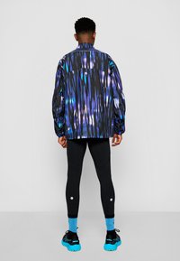 ASICS ROAD LITE SHOW JACKET - Veste coupe-vent - blue expanse