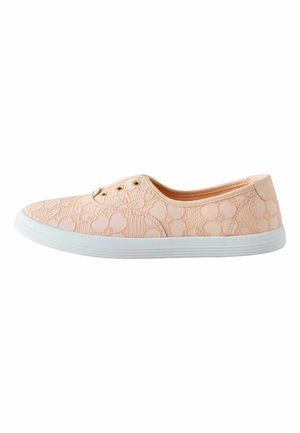 Light peach lace slip-on sneaker with floral pattern and white rubber sole, showing side profile without laces.