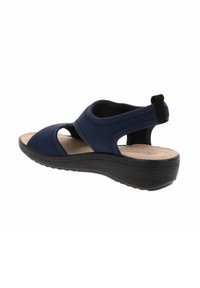 Sandalo blu navy con punta aperta e lati scoperti, dotato di soletta imbottita e suola in gomma nera texturizzata con zeppa. Cinturino posteriore regolabile.