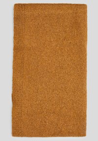 Tapis de bain rectangulaire et texturé de couleur orange brûlé avec une surface en tissu doux et bouclé et des détails de bordure cousue.