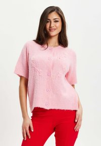 Short-sleeve, light pink cardigan made of fluffy knit material, featuring a button closure and small decorative accents on the front.