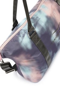 Duffle bag with a tie-dye pattern of purple, blue, and pink. Features black shoulder straps and a pink zip closure. Bottom has a flat design.