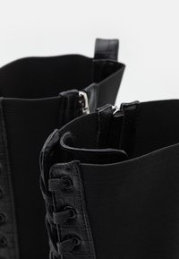 RAID Bottes à plateau - black
