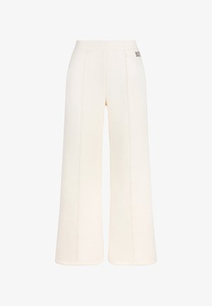 Brede sweatpants van zacht crème stof, met een elastische tailleband en zichtbare stikdetails. Subtiel logo aan de zijkant.