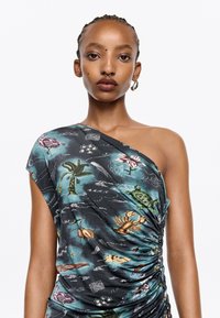 One-shoulder, ruched dress in black fabric, featuring a colorful underwater print with marine life, plants, and decorative elements.