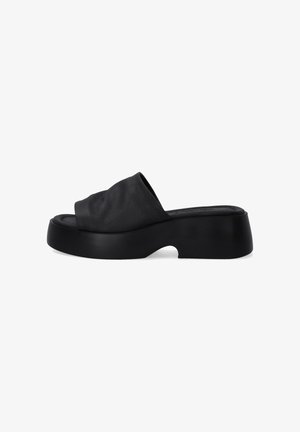 Black slide sandals with a soft, textured upper and a chunky platform sole. Features a wide, gathered strap over the foot.