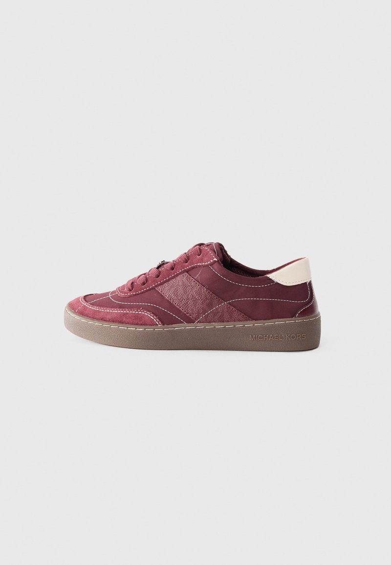 Burgundy sneakers with textured upper, contrasting accents, round toe, and rubber sole. Features logo on the side and white stitching details.