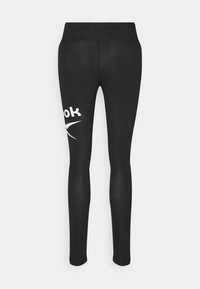 Fekete leggings sima, rugalmas anyagból. Az egyik oldalon egy fehér logó van nyomtatva. Magas derék a fokozott támaszért.