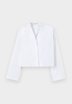 Λευκό cropped σακάκι με μακριά μανίκια, ανοιχτό μπροστινό μέρος χωρίς ορατά κουμπιά ή κούμπωμα, τοποθετημένο σε απλό φωτεινό φόντο.