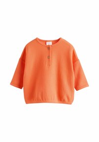 Kortärmad orange skjorta i texturerad tyg, med henley-krage och två träknappar samt avslappnad passform.