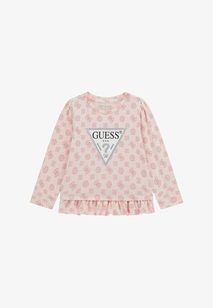 Gaiši rozā ilgu piedurkņu krekls ar vispārēju ziedu rakstu, trīsstūra logotipu centrā un ruffled apakšmalu.