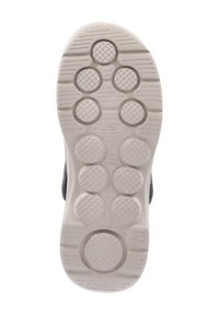 Shoe sole features a textured rubber design in gray with circular patterns for traction. Includes rounded and elongated grooves for grip.