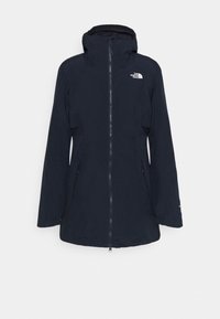 Granatowa wodoodporna kurtka z kapturem, pełny zamek z przodu, dwa boczne kieszenie i logo The North Face na lewej piersi. Gładki, trwały materiał.