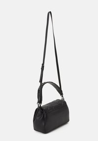 Black leather shoulder bag with a quilted design, a long adjustable strap, and a sleek, rectangular shape. Smooth texture, minimal detailing.