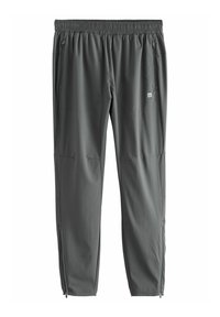 Pantalones deportivos grises con cintura elástica, bolsillos laterales y cremalleras en los tobillos. Fabricados con una tela ligera y suave.