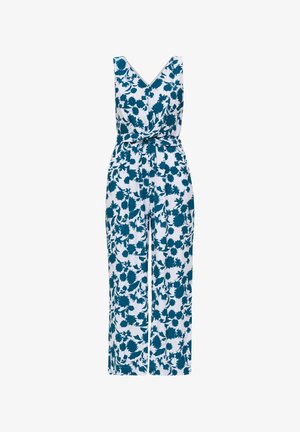 Weißer ärmelloser Jumpsuit mit tiefem V-Ausschnitt, blauem Blumenmuster und passendem Stoffgürtel, der tailliert gebunden ist.