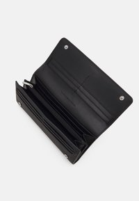 Tommy Hilfiger EMBLEM LARGE FLAP WALLET - Wallet - black