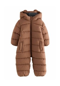 Tuta da neve marrone a sacco con cuciture orizzontali, cappuccio e due tasche frontali. Materiale morbido e polsini elasticizzati alle caviglie.