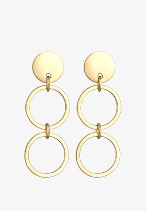 Boucles d'oreilles dorées présentant un clou rond et trois anneaux ouverts interconnectés. La texture lisse et le design circulaire mettent en valeur l'effet superposé.