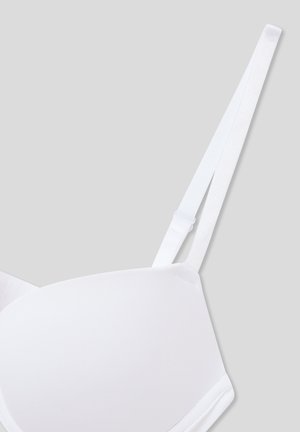 Reggiseno bianco modellato con spalline sottili regolabili, texture liscia, design senza cuciture e dettagli di cucitura discreti.
