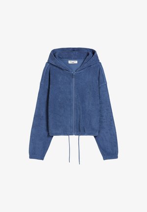 Blauwe zip-up hoodie gemaakt van zachte, gestructureerde stof. Heeft ribbelboorden en een verstelbaar koord aan de onderkant. Gekropen design.