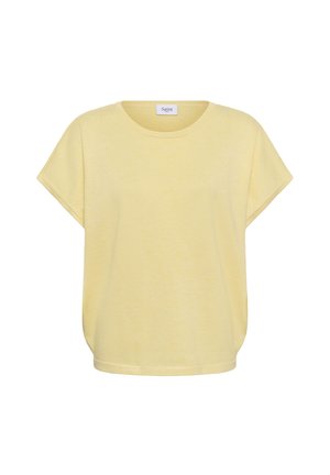 Haut ample à manches courtes de couleur jaune clair avec un col rond et une petite étiquette en tissu à l'intérieur du col.