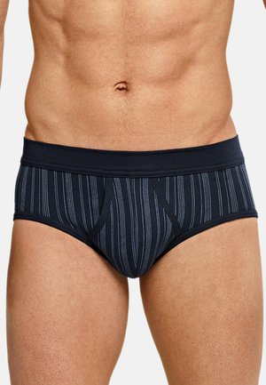 Marineblaue gestreifte Slips aus weichem Stoff, mit einem breiten elastischen Bund und einem vorderen Beutel-Design. Vertikale weiße Streifen durchgehend.